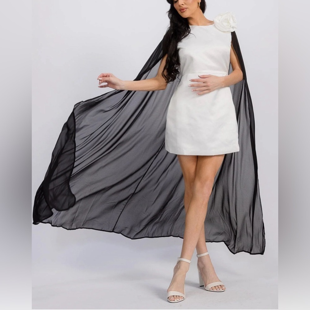 Elegant White and Black Dress with Cape